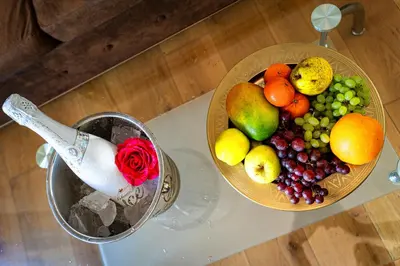 a bowl of fruit on a table with a bowl of fruit at Premium Dog Suite in Prague