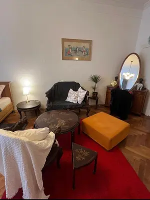 a living room with a couch and a table at Štěpánská noc A in Prague