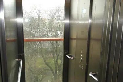 a bathroom door with a view of a window at Tower Apartment in Prague