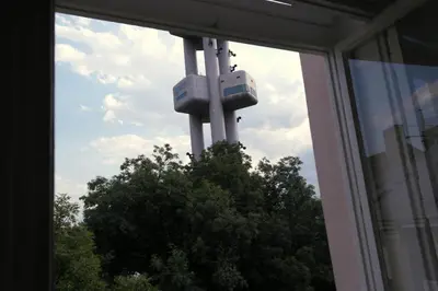 a view of a tv tower from a window at Tower Apartment in Prague