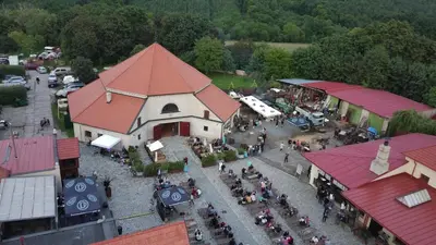 an overhead view of a building with a crowd of people at Černokostelecký pivovar in Kostelec nad Černými Lesy
