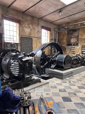 a museum with a machine on display in a room at Černokostelecký pivovar in Kostelec nad Černými Lesy