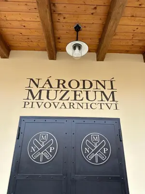a sign on a wall above a door at Černokostelecký pivovar in Kostelec nad Černými Lesy