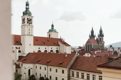 a view of a city with a clock tower at LIL Apartment with Tyn Cathedral View, Parking & AC in Prague