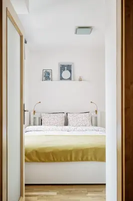a bedroom with a bed with a mirror at LIL Apartment with Tyn Cathedral View, Parking & AC in Prague