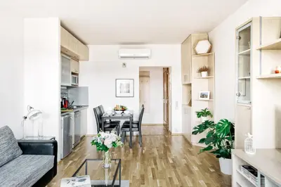 a living room and dining room with a table and chairs at LIL Apartment with Tyn Cathedral View, Parking & AC in Prague