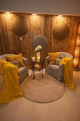 a living room with two couches and a table at Relax u potoka, vířivka, swimSpa, sauna