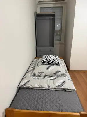 a bed in a small room with a bed frame at YCZ Praha in Prague