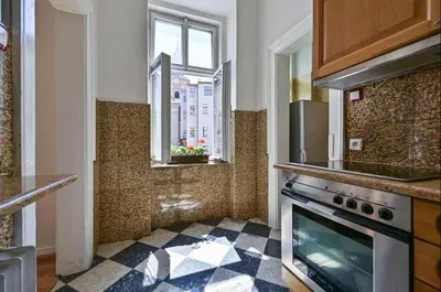 a kitchen with a stove and a window at Golden Prague Residence, Jáchymova Street in Prague