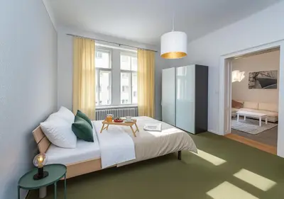 a bedroom with a bed with a table on it at Cozy apartment with 2 bedrooms in New Town in Prague