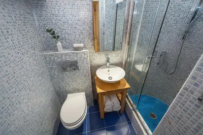 a bathroom with a toilet and a sink and a shower at Cozy apartment with 2 bedrooms in New Town in Prague