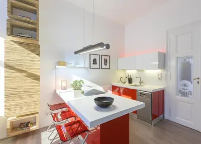 a kitchen with red cabinets and a bowl on a counter at Cozy apartment with 2 bedrooms in New Town in Prague