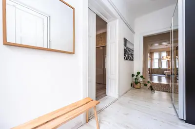 a hallway with a bench and a mirror at Cozy apartment with 2 bedrooms in New Town in Prague
