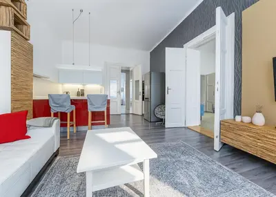 a living room with a couch and a table at Cozy apartment with 2 bedrooms in New Town in Prague