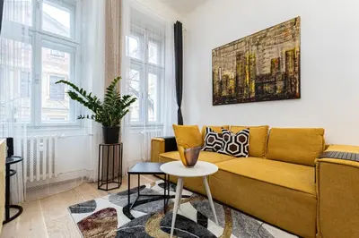 a living room with a dining room table and chairs at Charm Vinohrady in Prague