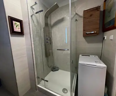 a glass shower in a bathroom with a toilet at Central Cozy Comfort Loft in Prague