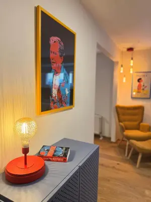 a lamp sitting on top of a table in a room at Negroni Apartment in Prague