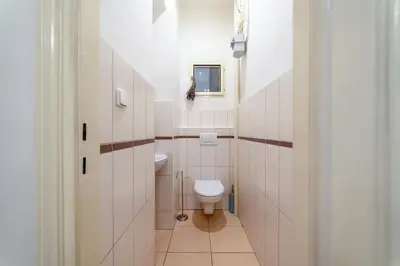 a small bathroom with a toilet and a sink at Charming Apartment in the Heart of Prague by Rentez in Prague