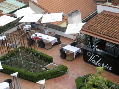 an overhead view of a restaurant with tables and umbrellas at Apartment Paradise Michalská in Prague