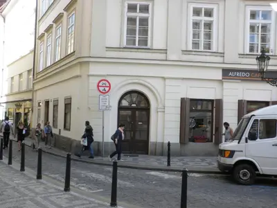 a group of people walking in front of a building at Apartment Paradise Michalská in Prague