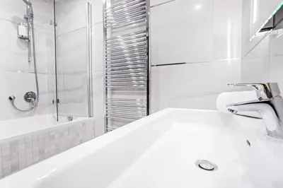 a bathroom with a tub and a sink and a shower at Parking Free Onsite, Air Conditioning, Wenceslas Square in Prague