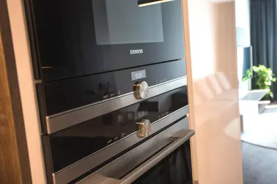 a black oven with a microwave on top of it at Parking Free Onsite, Air Conditioning, Wenceslas Square in Prague