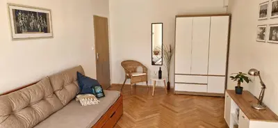a living room with a couch and a table at Prague Green Hideaway near Centre in Prague