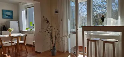 a kitchen with a table and chairs and a window at Prague Green Hideaway near Centre in Prague