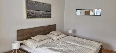 a bedroom with a bed with two pillows on it at Prague Green Hideaway near Centre in Prague