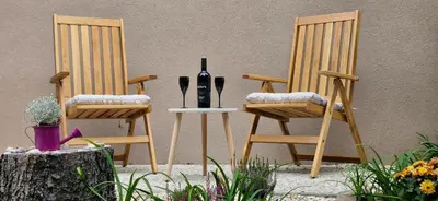 two chairs with a bottle of wine on a table at Prague Green Hideaway near Centre in Prague