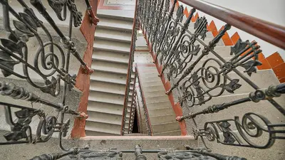 a set of stairs leading up to a building at Spacious & Modern Apartment by Wenceslas Square in Prague