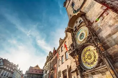 a building with a clock on the side of it at Spacious 8-Person Apartment in the Heart of Prague in Prague