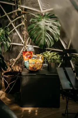 a table with plants and a basket on it at Forest Home Okoř in Okoř
