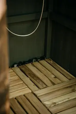 a wooden floor with a chain on top of it at Forest Home Okoř in Okoř