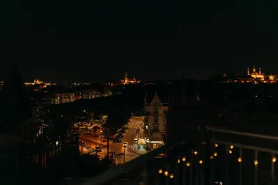 a view of a city at night with lights at Maisonette with terrace and view of Prague Castle in Prague