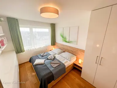 a bedroom with a bed and a window at Incredible Luxury Apt with Garage and Tram Station in Prague