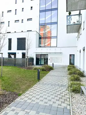 a building with a brick walkway in front of it at Incredible Luxury Apt with Garage and Tram Station in Prague