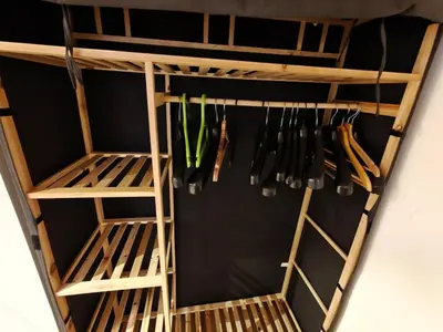 a closet with wooden shelving at My sweet place in Prague