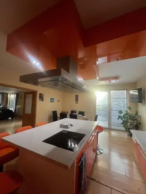 a kitchen with an island with a stove top oven at Sabina house in Vestec