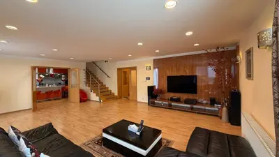 a living room with a couch and a tv at Sabina house in Vestec