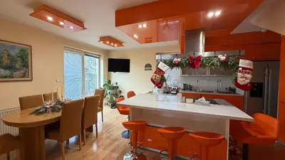 a kitchen with a christmas decorations on the wall at Sabina house in Vestec