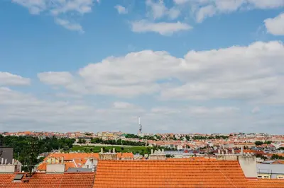 a view of a city with orange roofs at Prague Days - Top Floor Apartments with Terrace & AC near Vyšehrad Castle in Prague