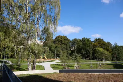 a park with a tree and a walk way at Mucha Residence - with free weekend parking in Prague