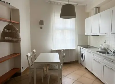 a bedroom with a bed with two pillows on it at Petrska Cozy 2 bedroom apartment near Old Town in Prague