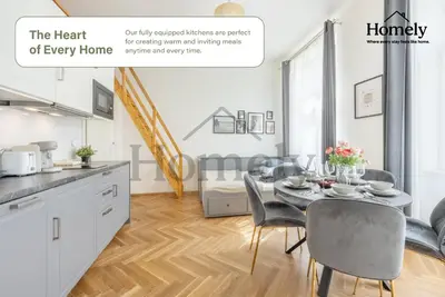 a kitchen and dining room with a table and chairs at HOMELY I Central 28m2 loft I ELEVATOR I Self Check-In in Prague