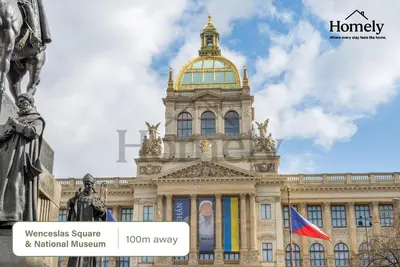 a building with a tower on top of it at HOMELY I Central 28m2 loft I ELEVATOR I Self Check-In in Prague