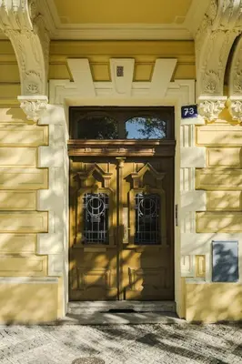 an entrance to a house with a wooden door at Modern design studio with fast WI-FI in Prague