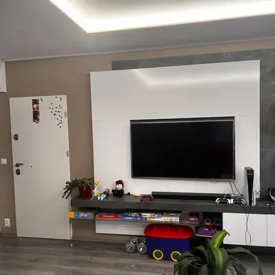 a living room with a flat screen tv on a wall at Apartment in Prague in a quiet location close to the center in Prague