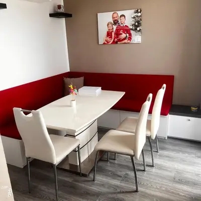 a dining room with a white table and white chairs at Apartment in Prague in a quiet location close to the center in Prague