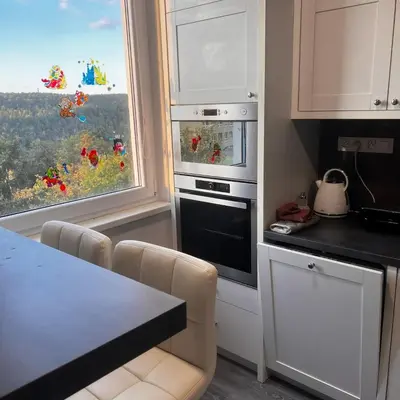a kitchen with a stove top oven next to a window at Apartment in Prague in a quiet location close to the center in Prague